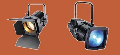 Two fresnel lanterns, one with barndoor flaps fitted around the lens